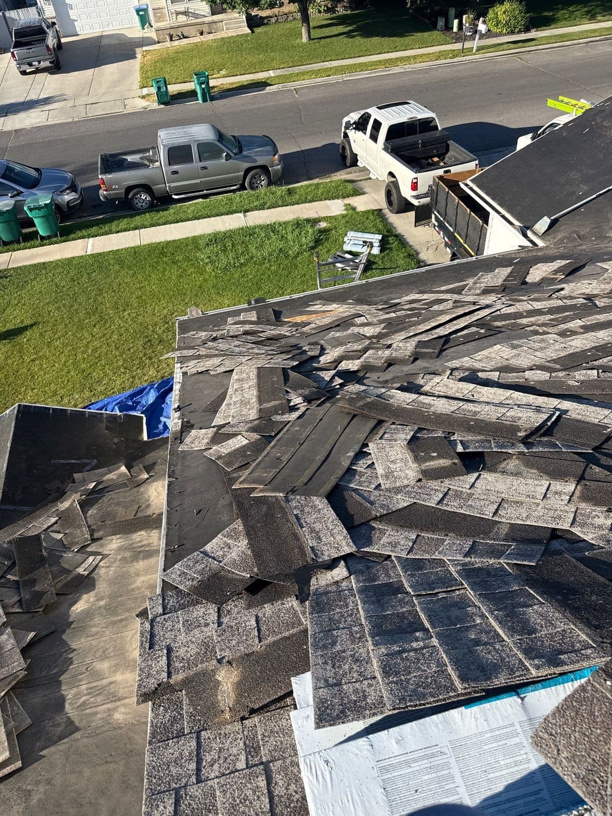 Old shingles being torn off