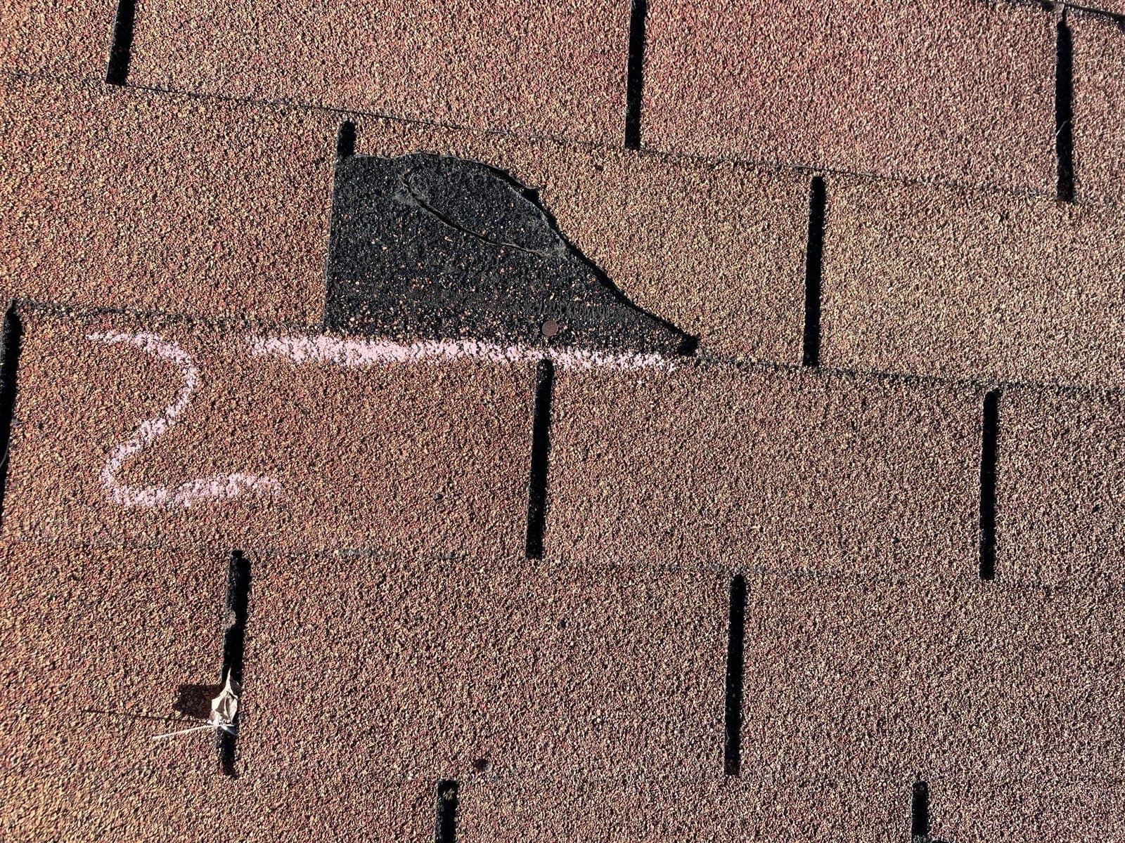 A shingle with a missing corner