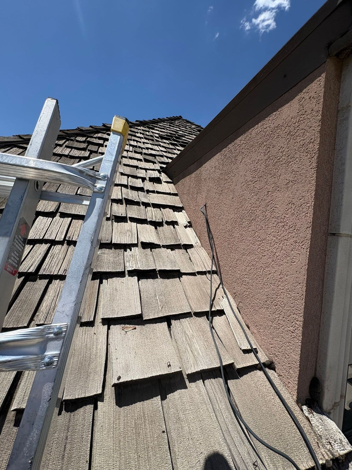 Two stories up at 10/12 pitch. Every repair means walking on it