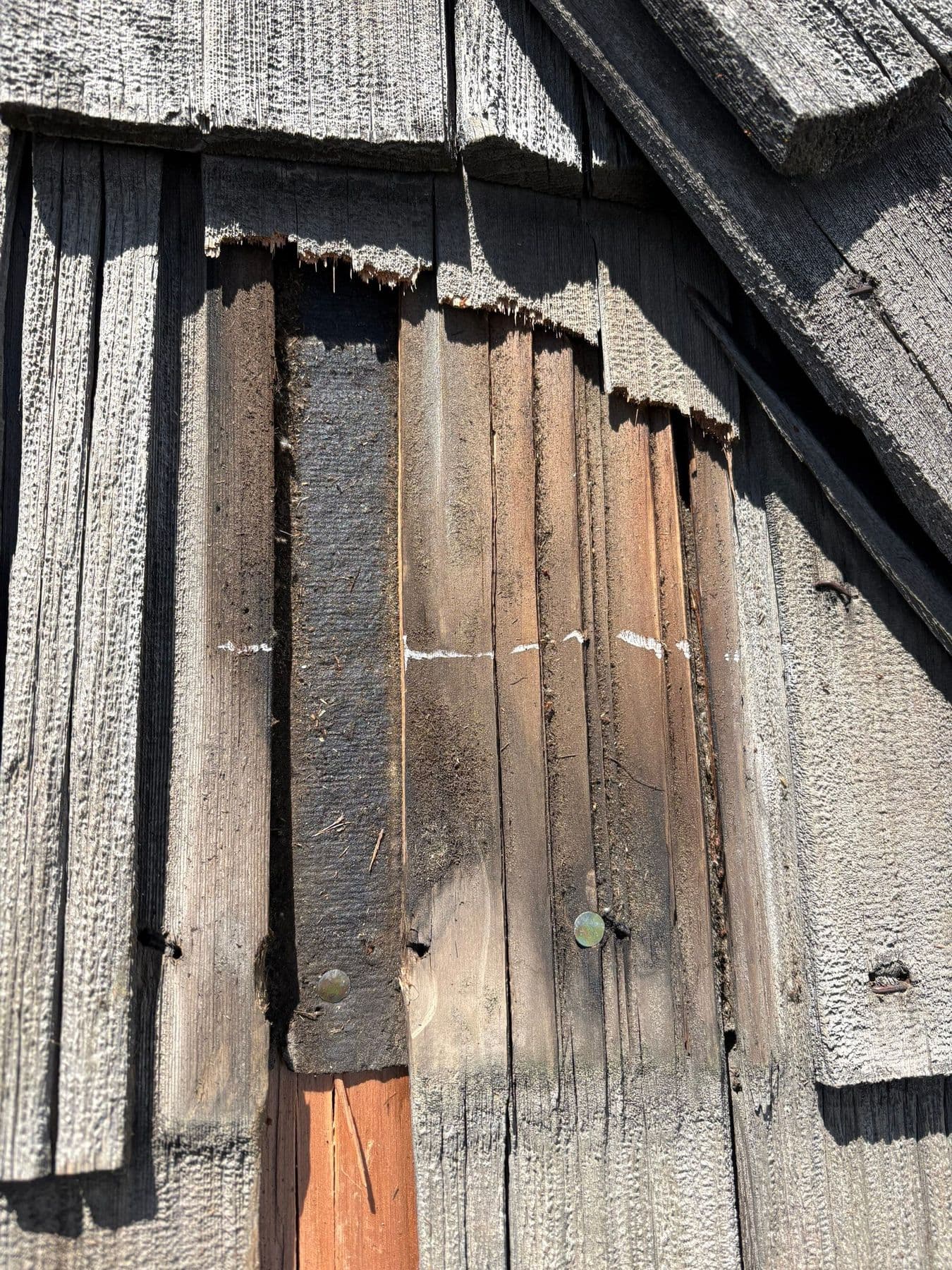 The shake above the repair cracks down its length
